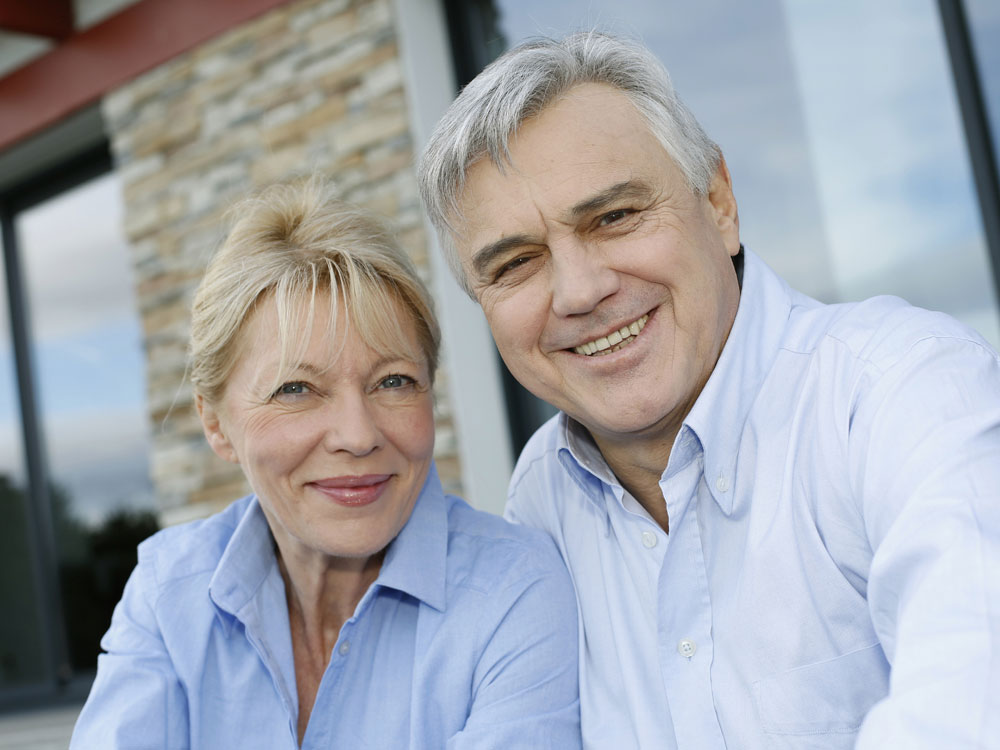 A man and woman smiling for the camera.