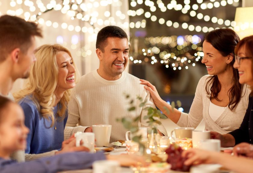 A group of people sitting around a table.