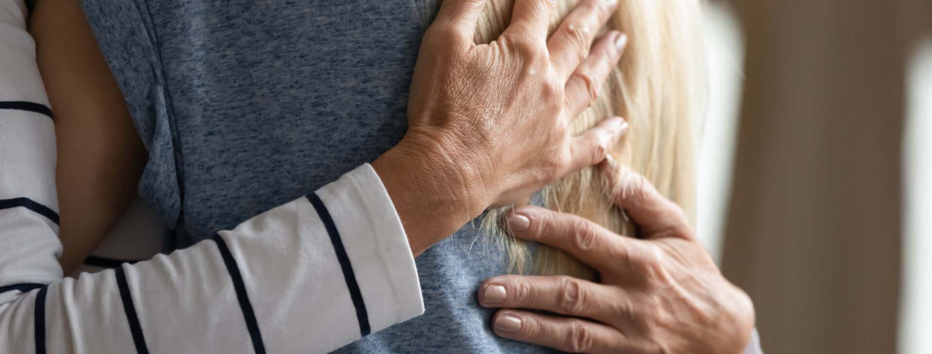 A person with their hands touching each other.